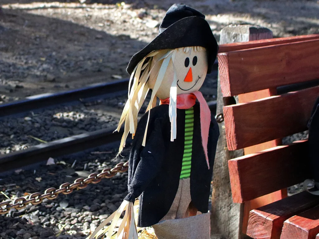 Friendly scarecrow decoration by railroad tracks at Georgetown Loop Pumpkinfest fall event