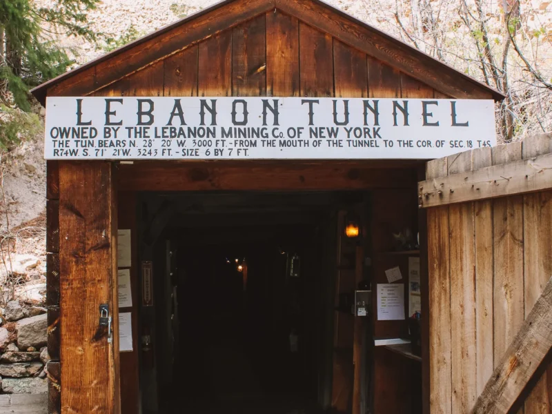 Historic Lebanon Tunnel mine entrance showing original mining company sign at Georgetown Loop